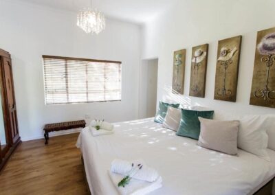 King bed with four paintings